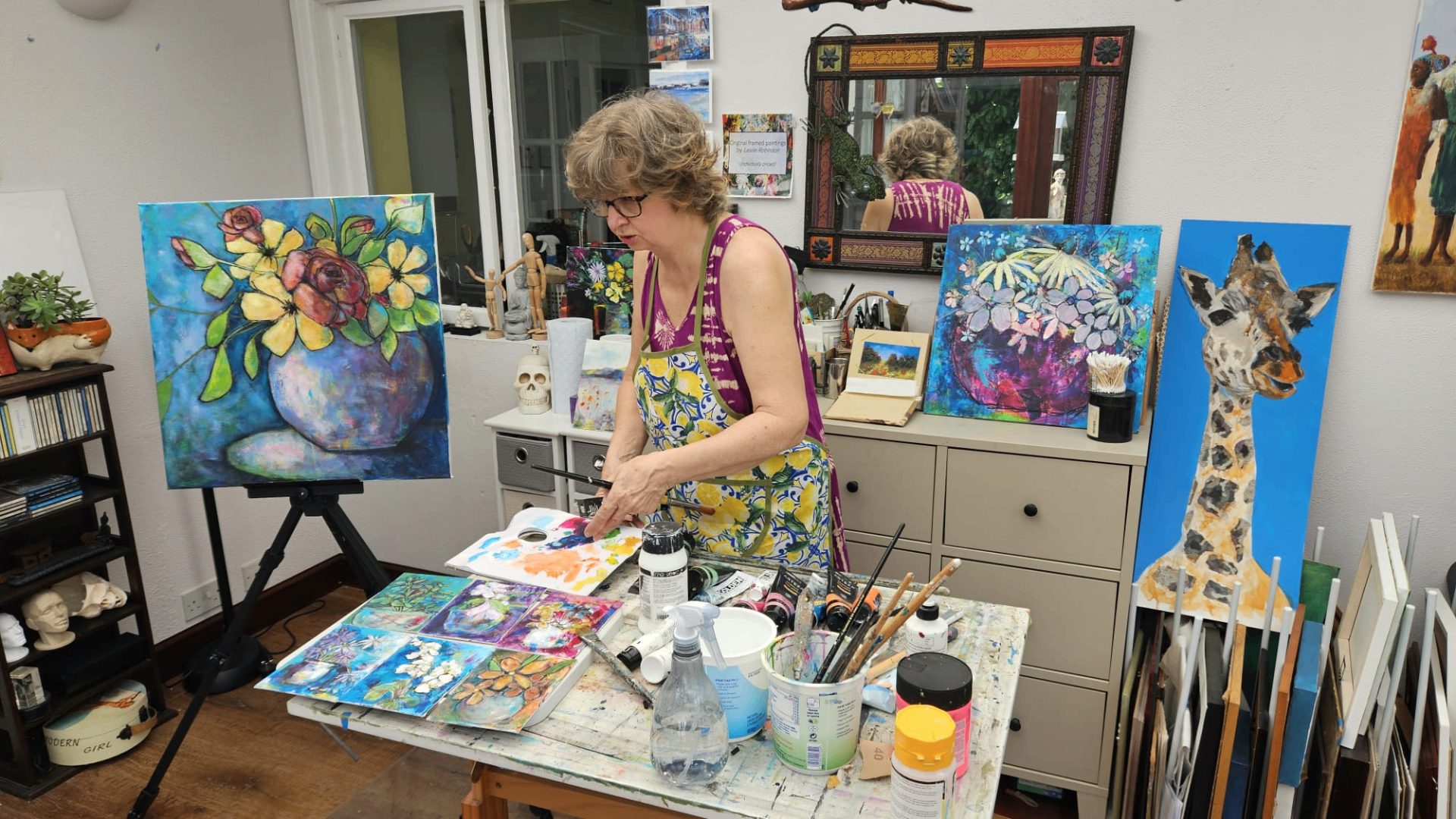 Leslie at work in her garden-room studio